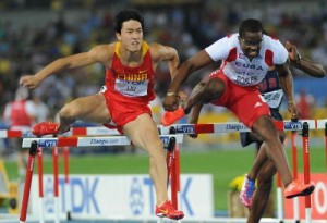 Robles grabs the arm of Liu, altering the course of hurdle history.